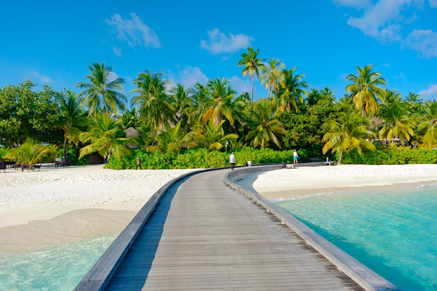 Am weißen Strand in Kuba entspannen gut abgesichert mit Stornoschutz und Reiseversicherung.